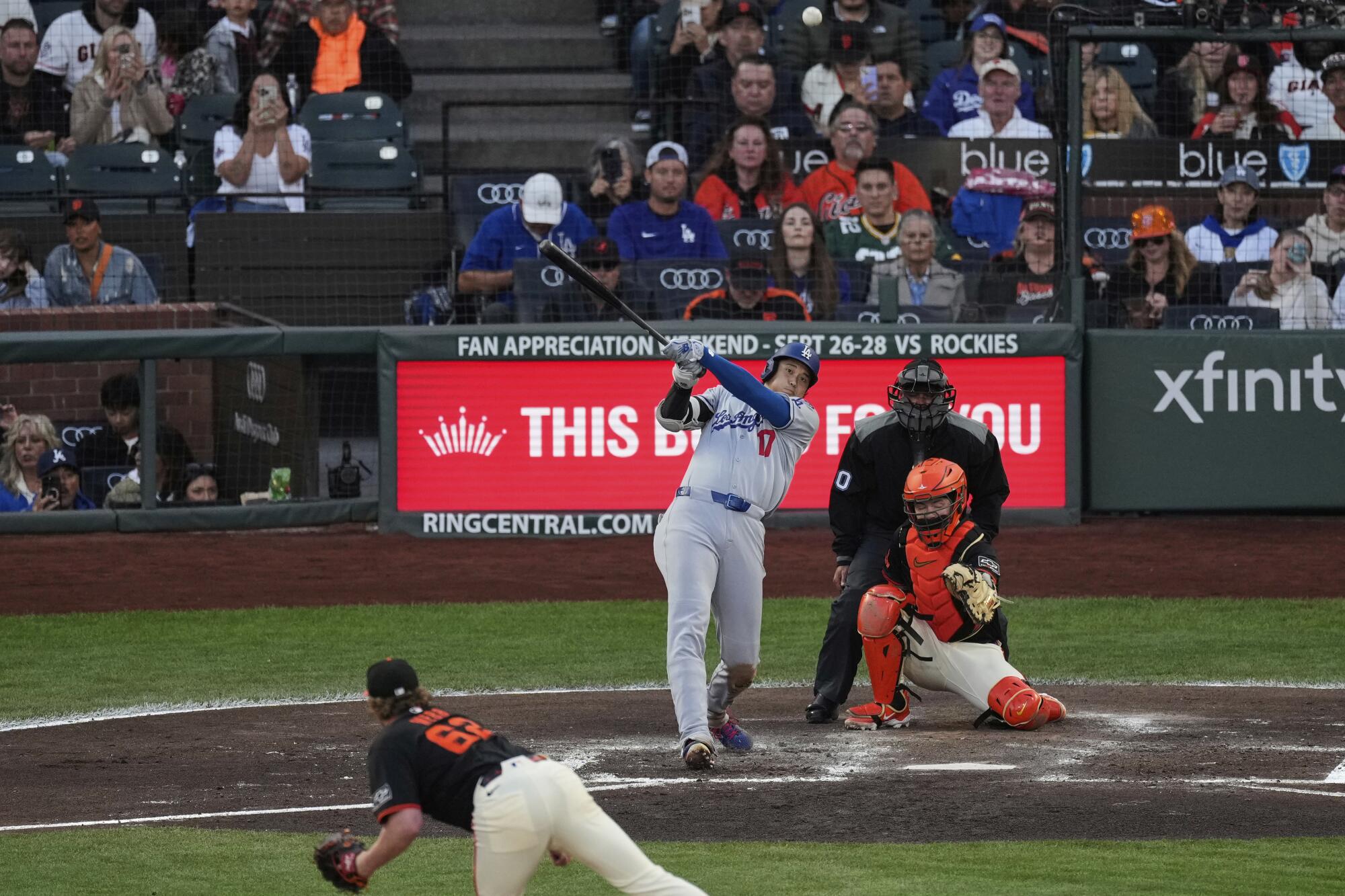 Shohei Ohtani hits a solo home run in the third inning Saturday against the Giants.
