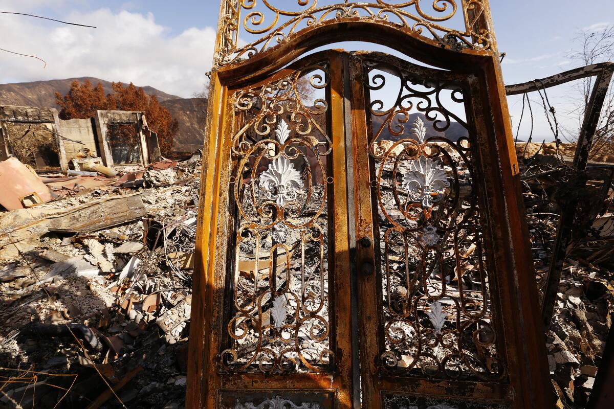 A Malibu home lies in ruins after the Woolsey fire. Many questions were raised about the response.