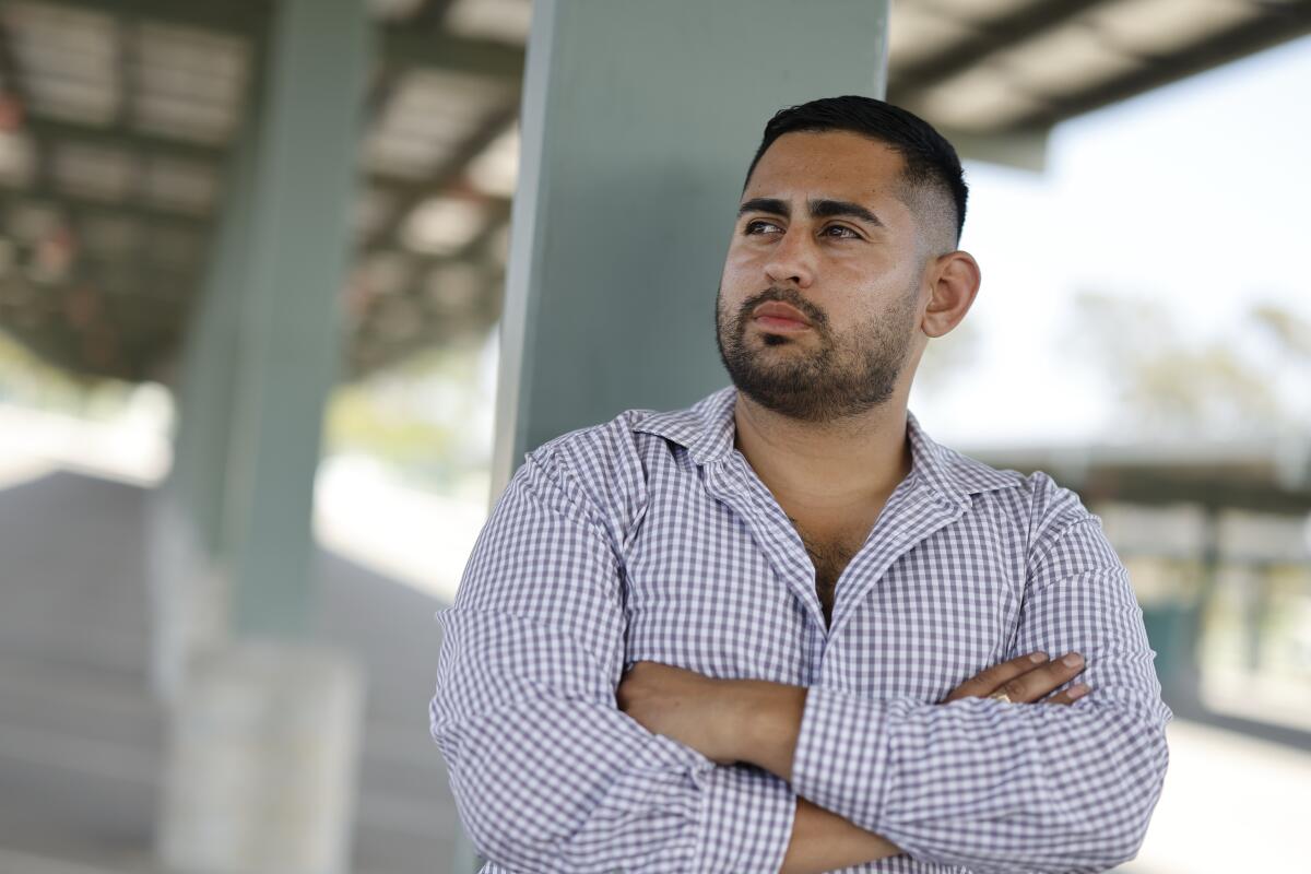 Brian Gavidia stands in a parking lot next to East Los Angeles College in Monterey Park