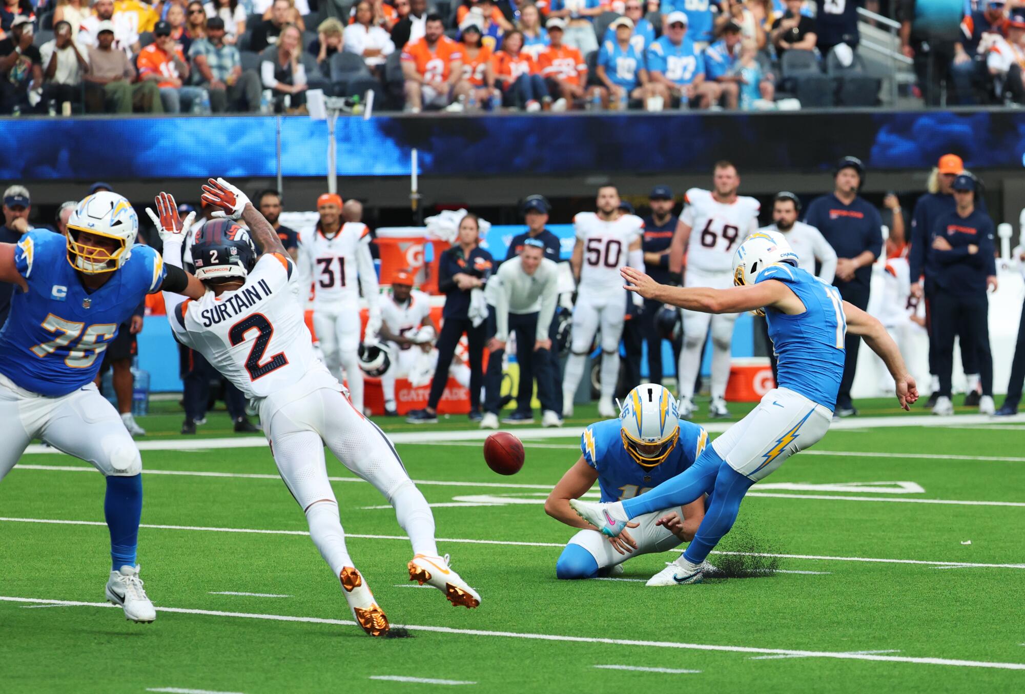 Cameron Dicker kicks the winning field goal as time expires in the Chargers' 23-20 win.