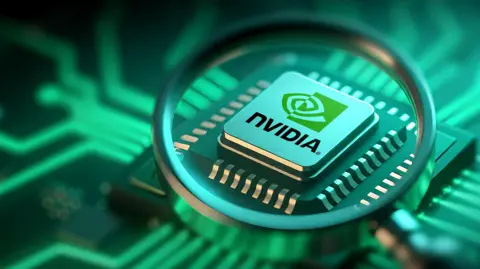 Getty Images An Nvidia computer chip seen through a magnifying glass