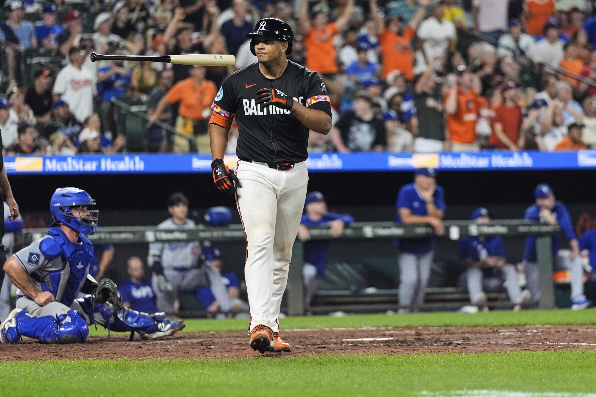 The Baltimore Orioles' Samuel Basallo flips his bat after hitting a walk-off home run against the Dodgers Friday.