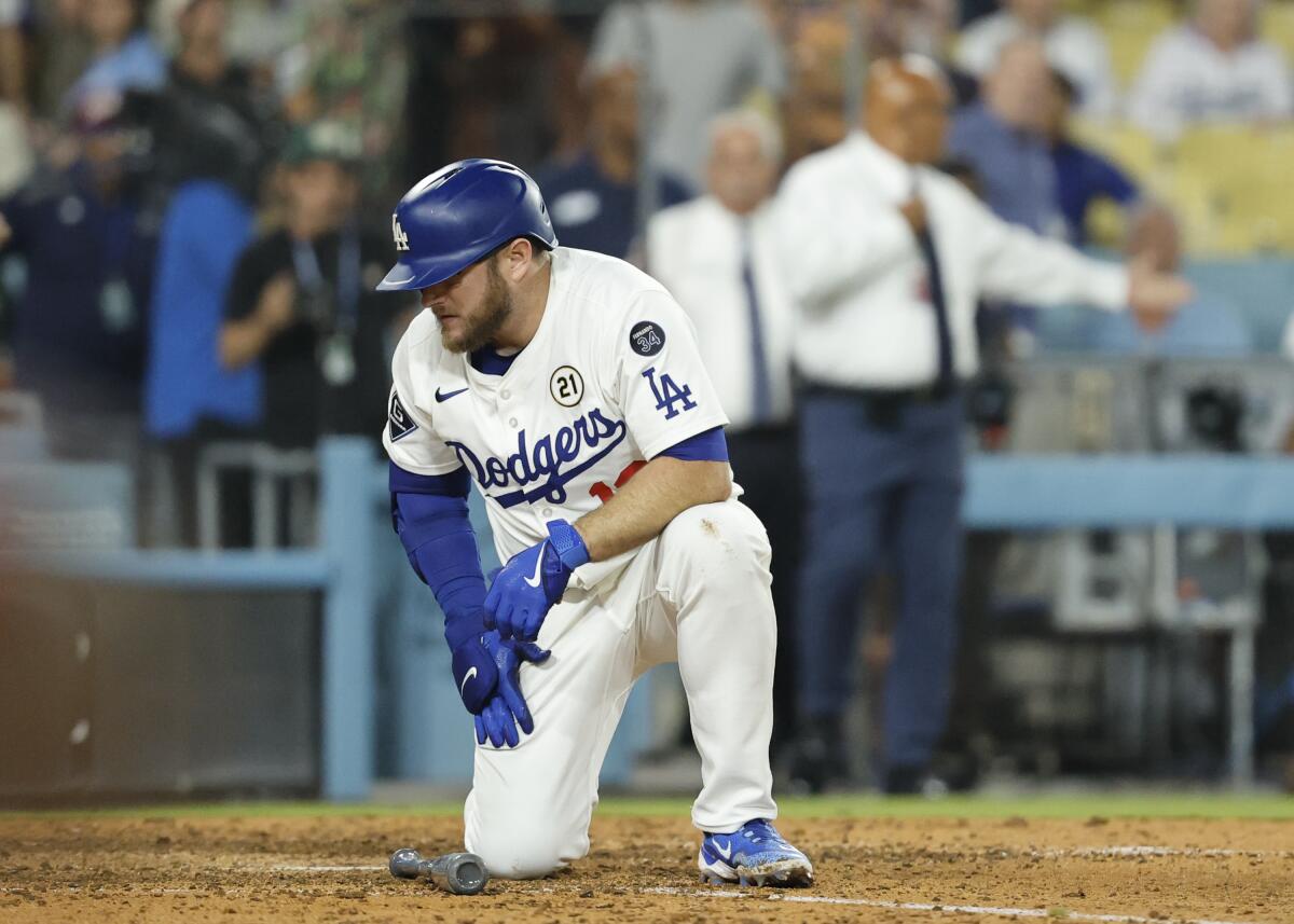 Dodgers third base Max Muncy reacts to grounding out in the 10th inning, sealing the Philles' win Monday .