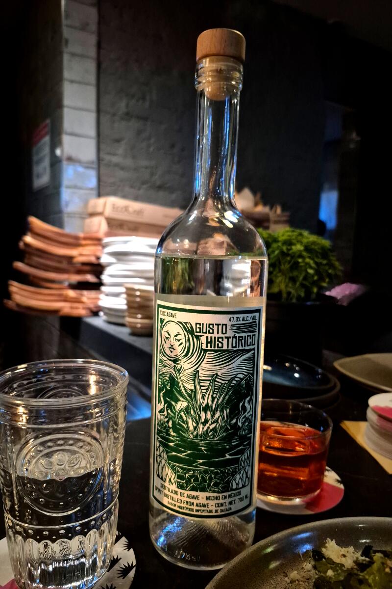 1. Sikil pak at Bar Sótano. 2. A mezcal by Gusto Histórico.