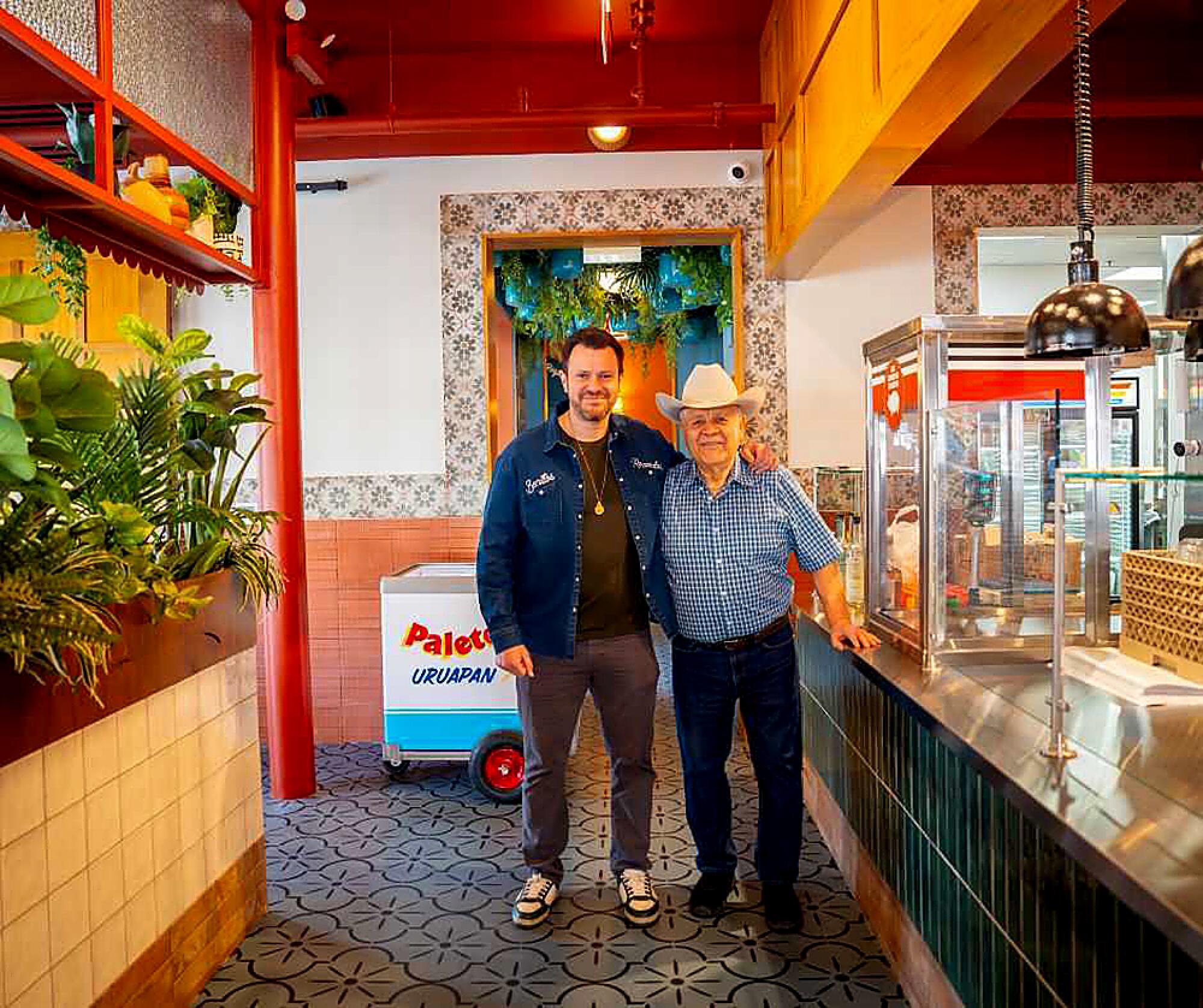 Owners Marcos Carbajal and his father Inocencio Carbajal inside the new dine-in location of Carnitas Uruapan.