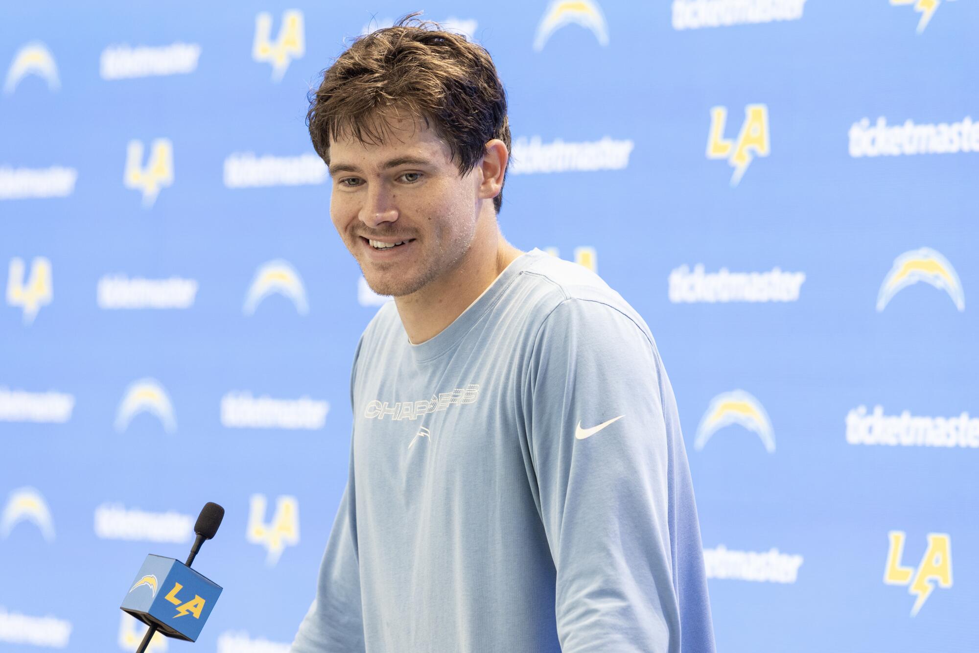 Chargers quarterback Justin Herbert speaks to reporters after the first day of training camp in July.