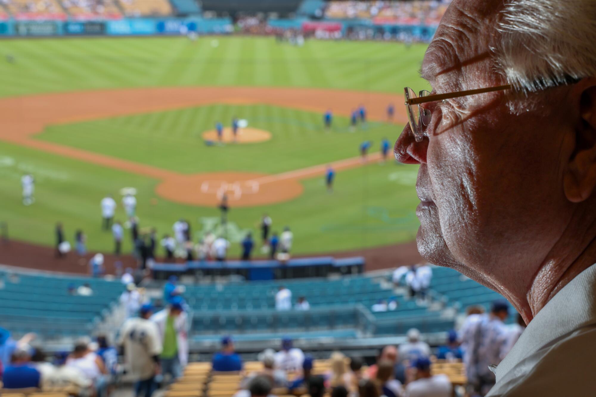 Bill Russell at his loge section perch where he observes umpires during games at Dodger Stadium. 