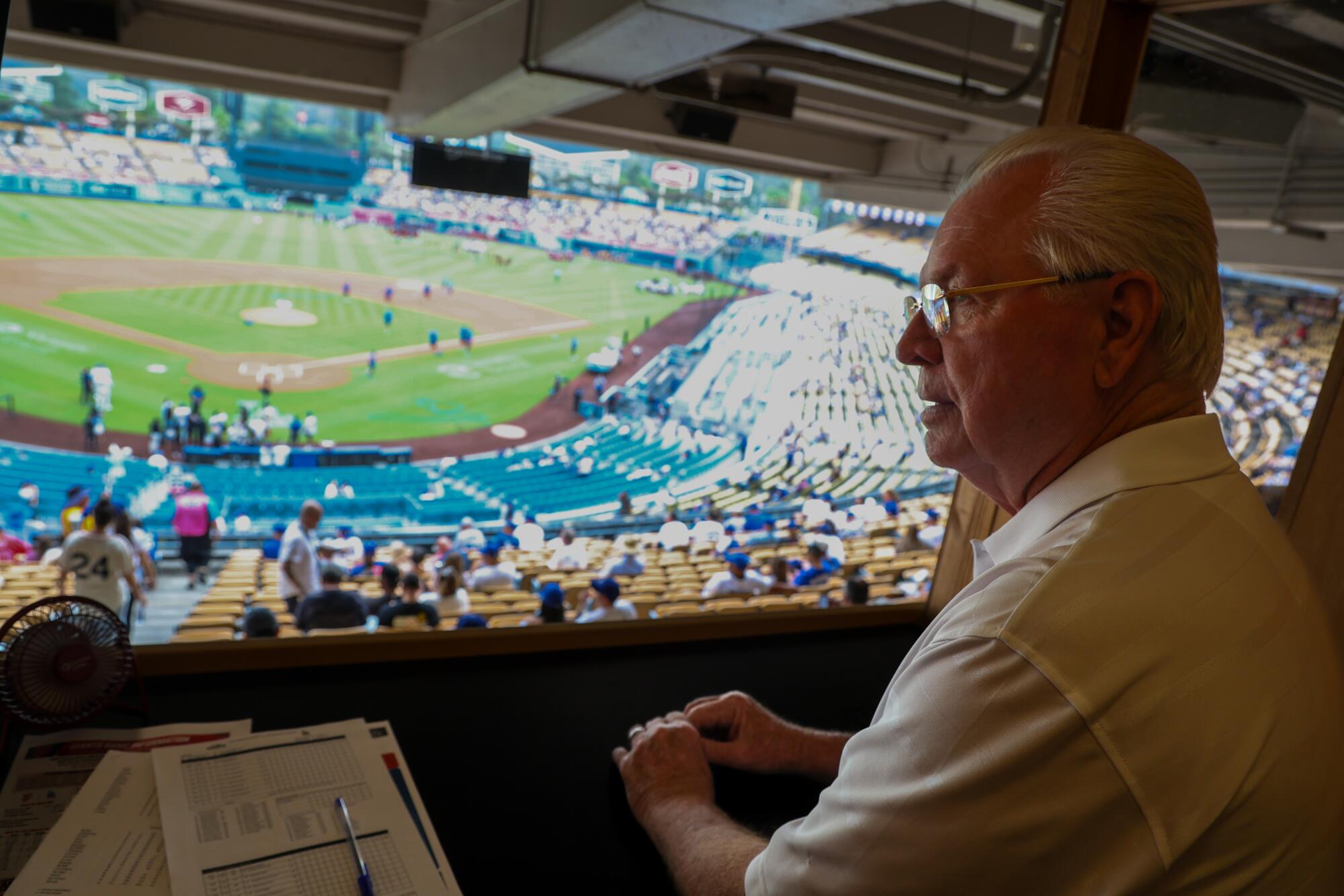Bill Russell at his loge section perch where he observes umpires during games at Dodger Stadium. 