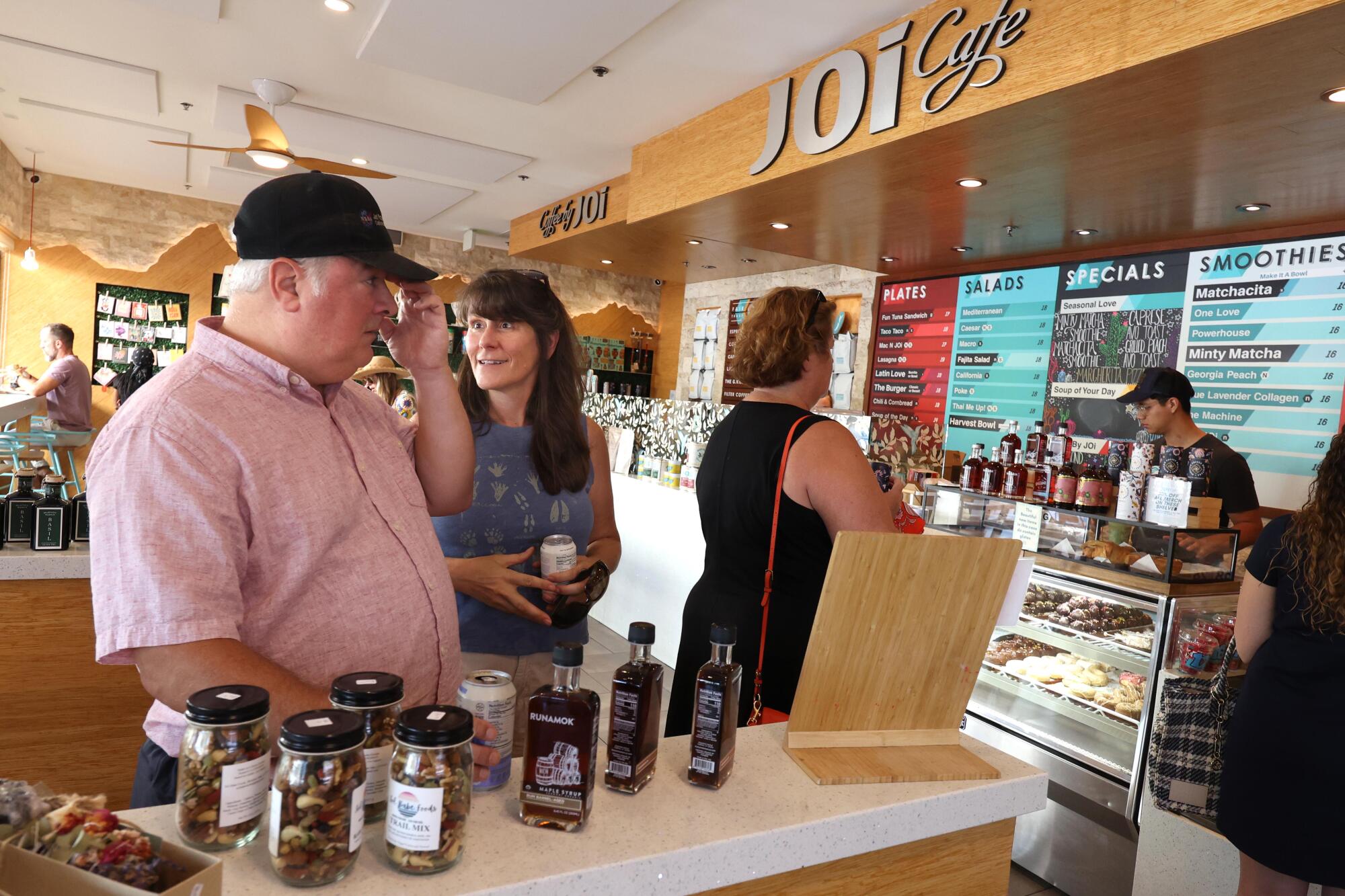 Marc and Julia Pierrat order lunch at the Joi Cafe in Westlake.