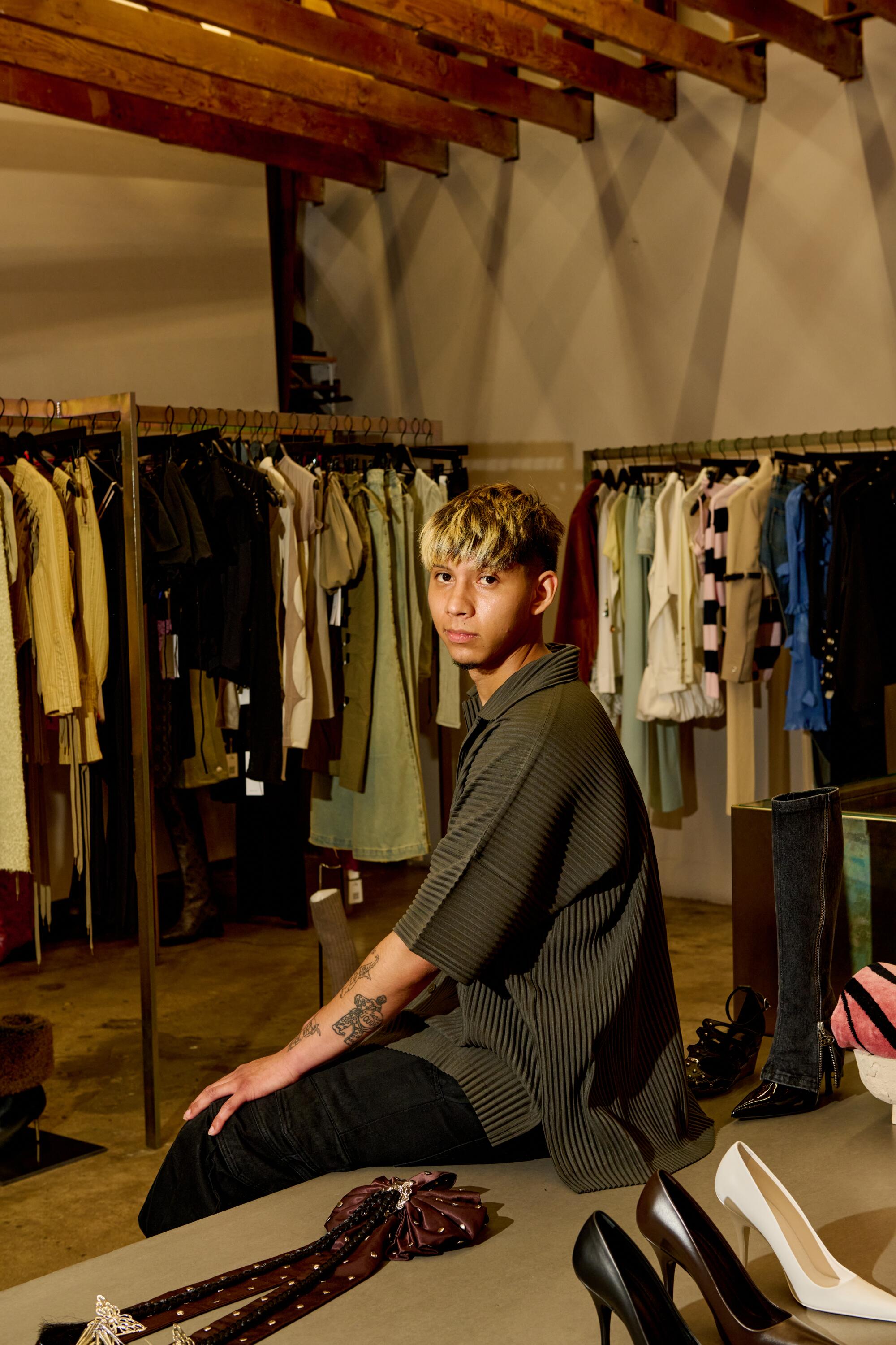 Derrick Arellanes, stock manager at HLNR, wears Issey Miyake Homme Plisse outfit.