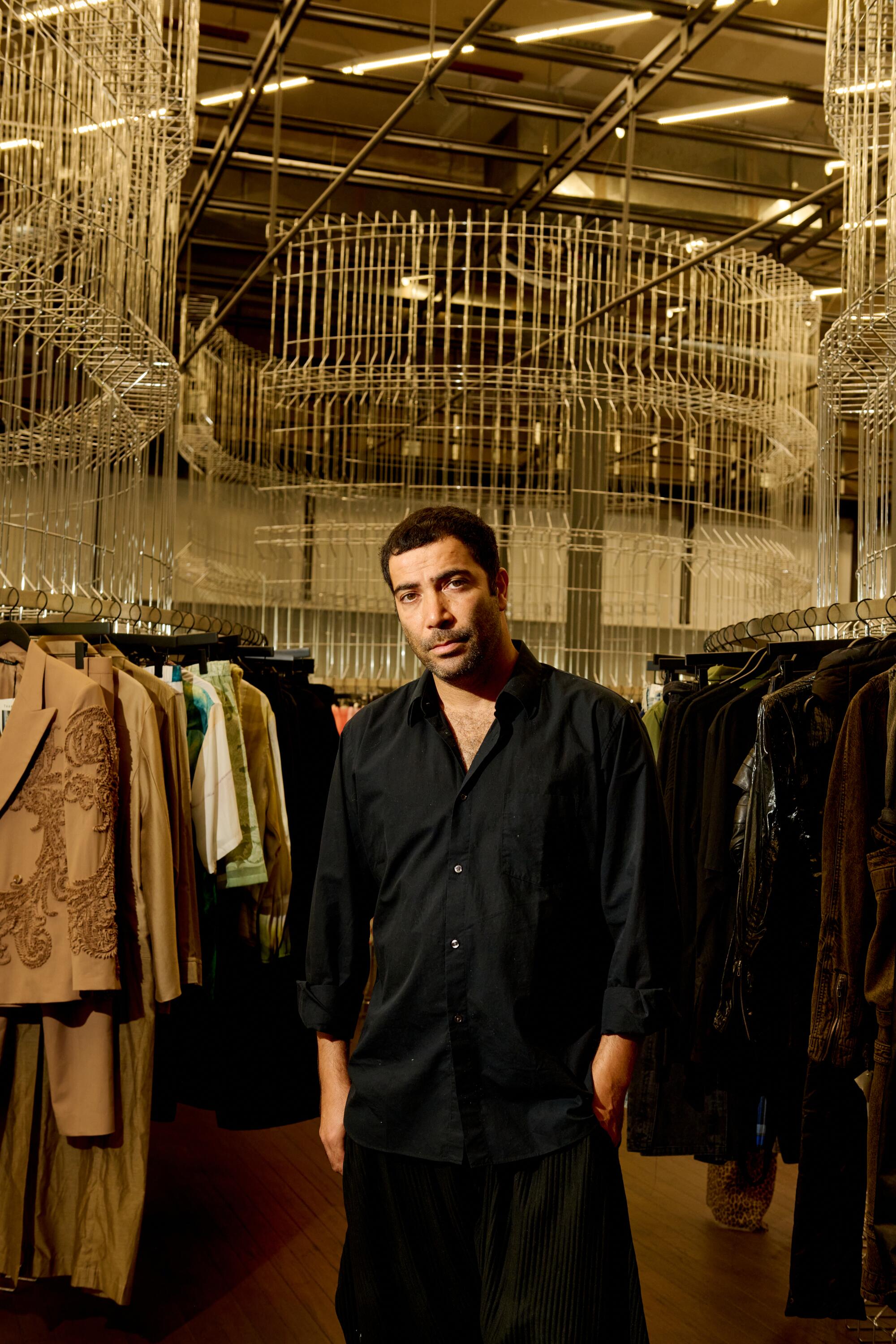 Mac Hadar, director of operations and menswear buyer, wears Comme des Garçons top, Issey Miyake bottoms and Nike shoes.