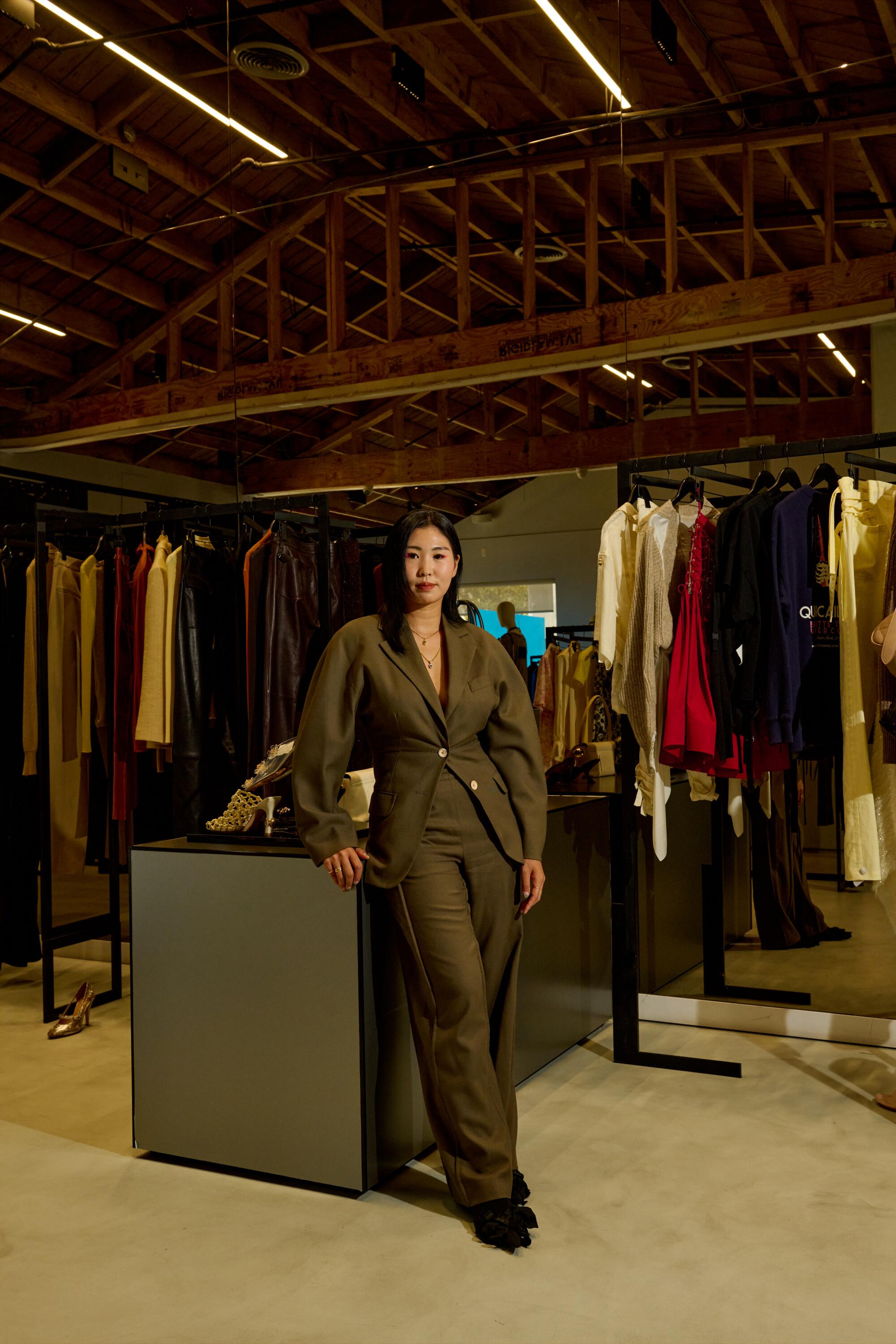 Athena Son, buyer and store manager of the H. Lorenzo women’s store, wears Acne Studios suit and Balenciaga shoes.