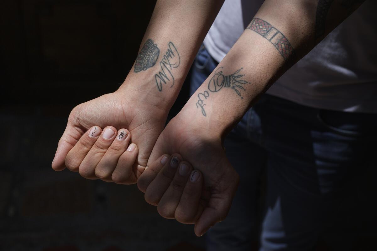 Hernández Romero shows the crown tattoos that U.S. authorities claimed linked him to the Tren de Aragua gang.