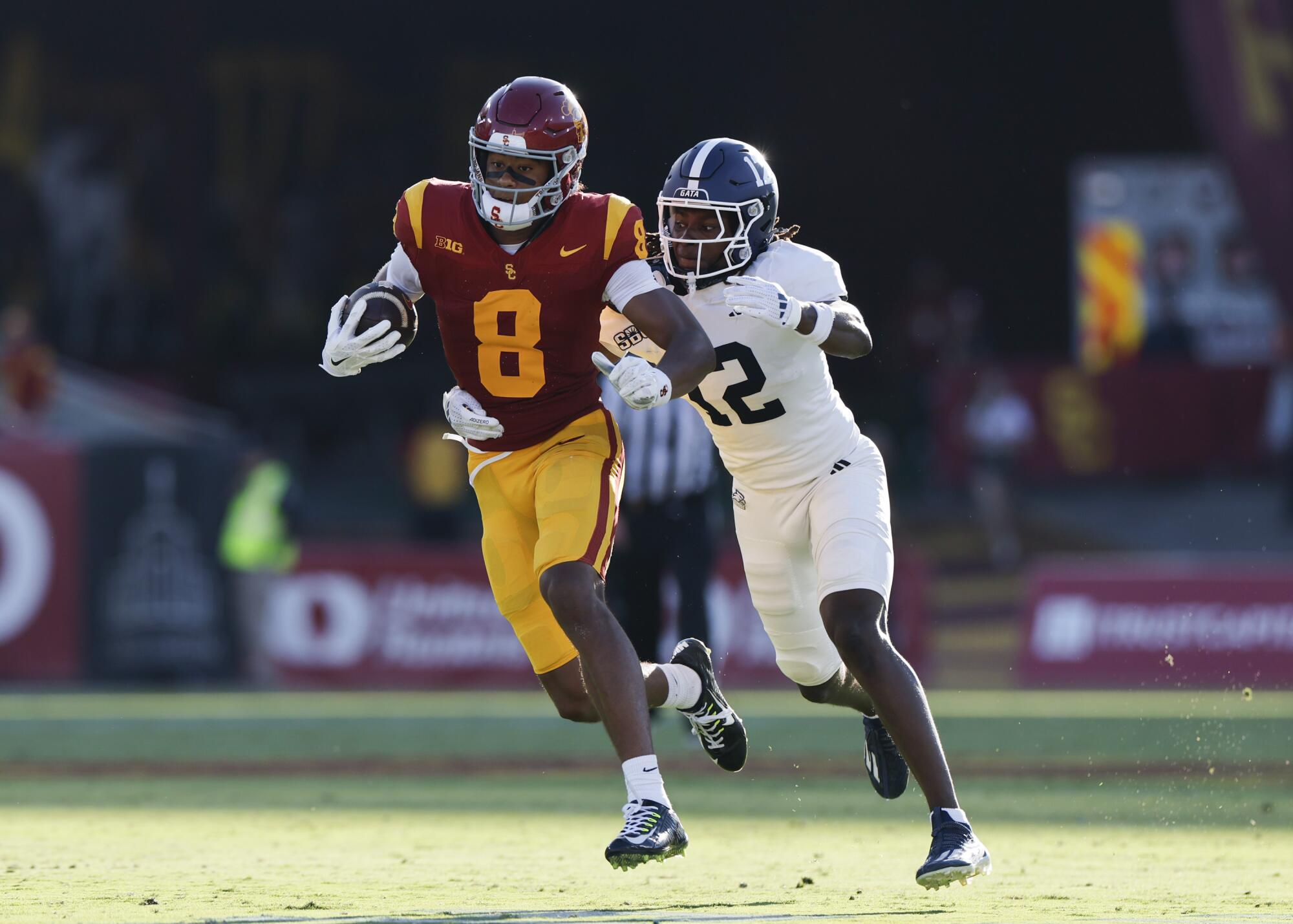 USC receiver Ja'Kobi Lane evades Georgia Southern defensive back Tracy Hill Jr. during the Trojans' win.