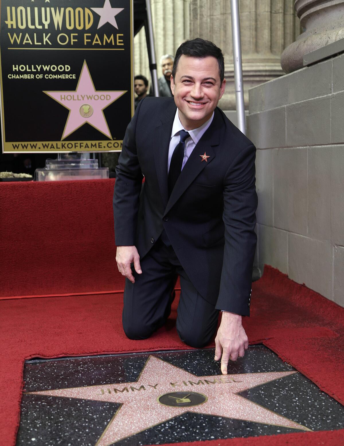 Jimmy Kimmel celebrates as he receives his star on the Hollywood Walk of Fame.