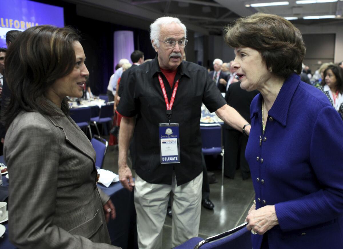 John Burton stands between Dianne Feinstein and Kamala Harris.