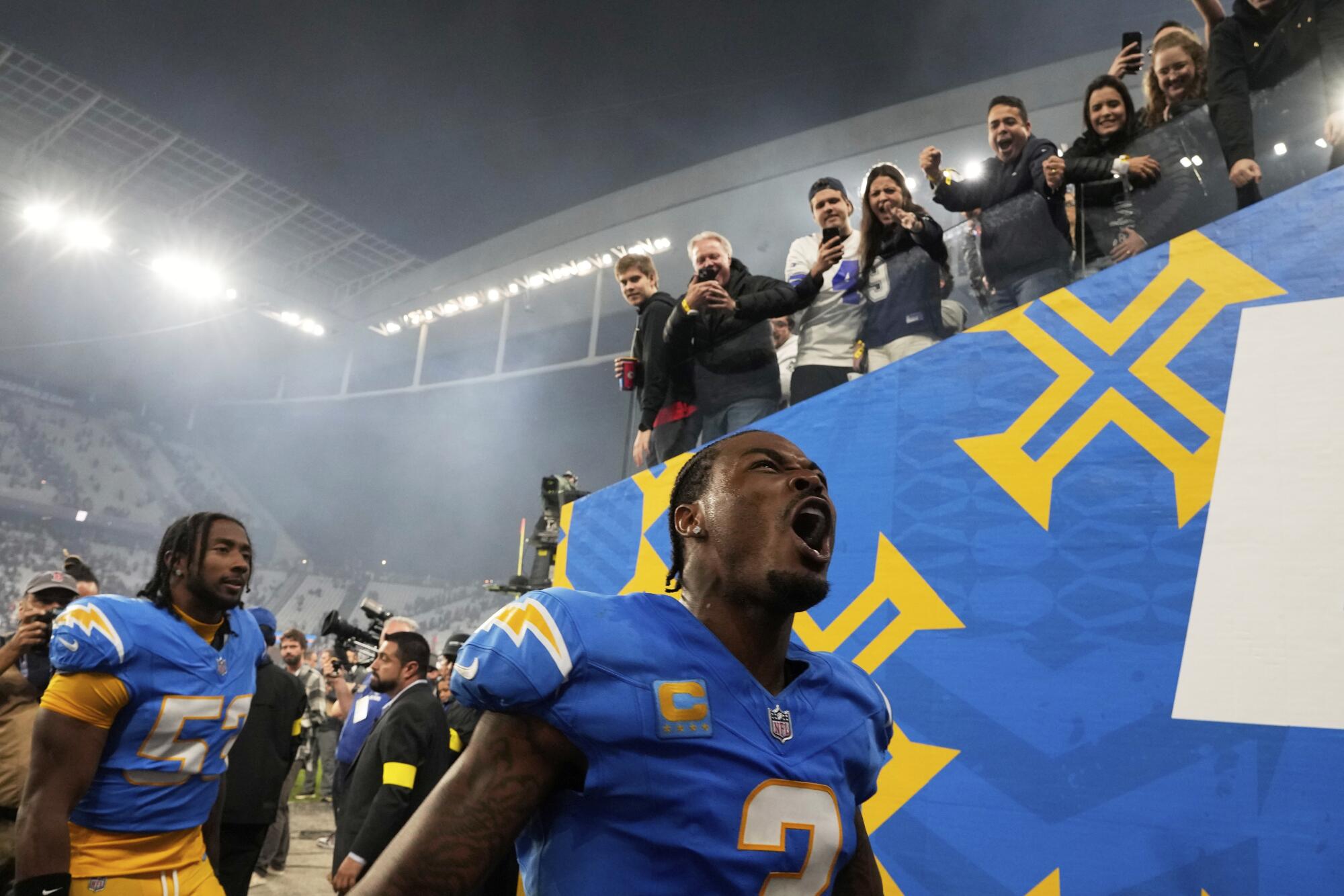 Chargers safety Derwin James Jr. celebrates after beating the Chiefs in Brazil on Friday night.