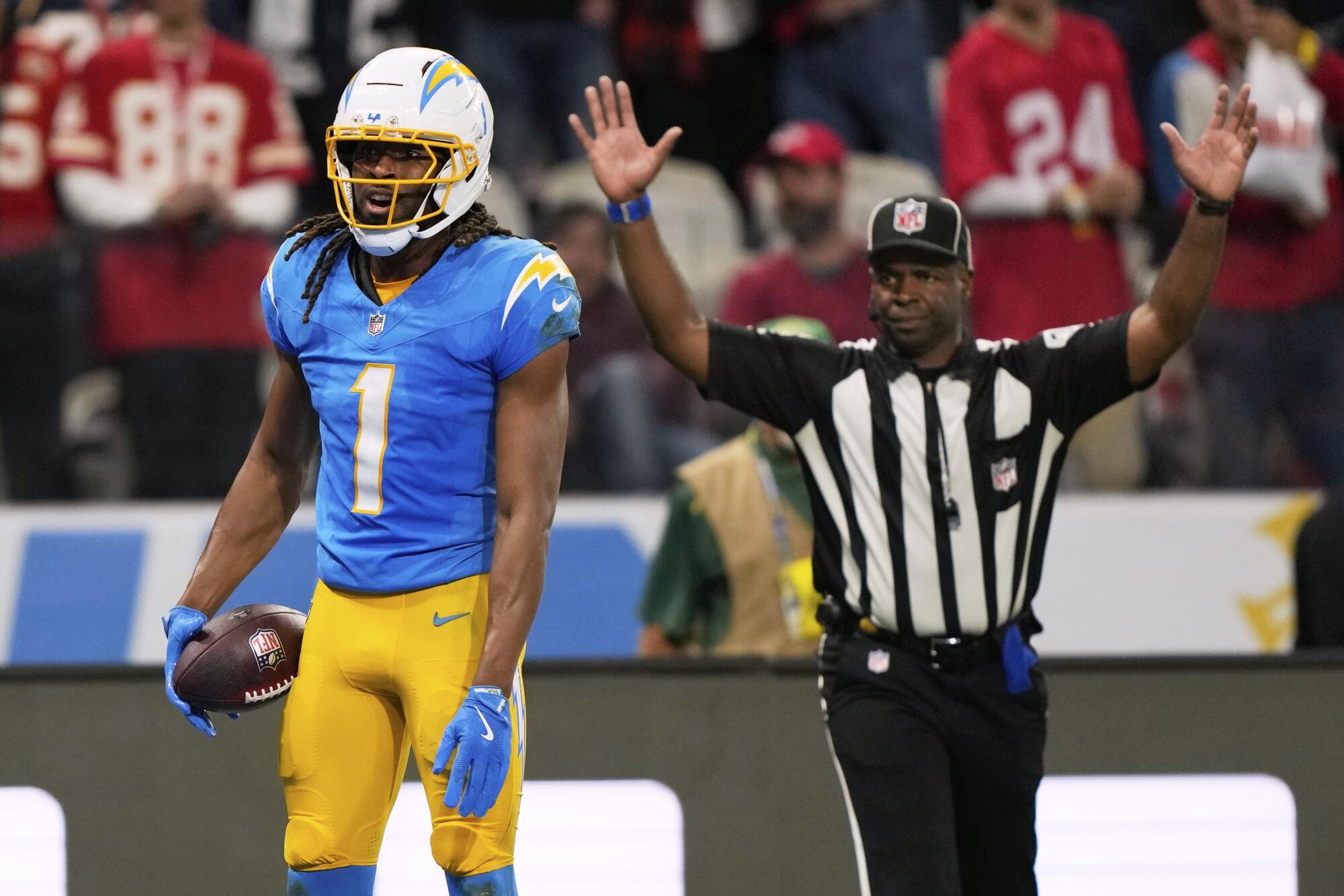 Chargers wide receiver Quentin Johnston reacts after catching a 23-yard touchdown pass.