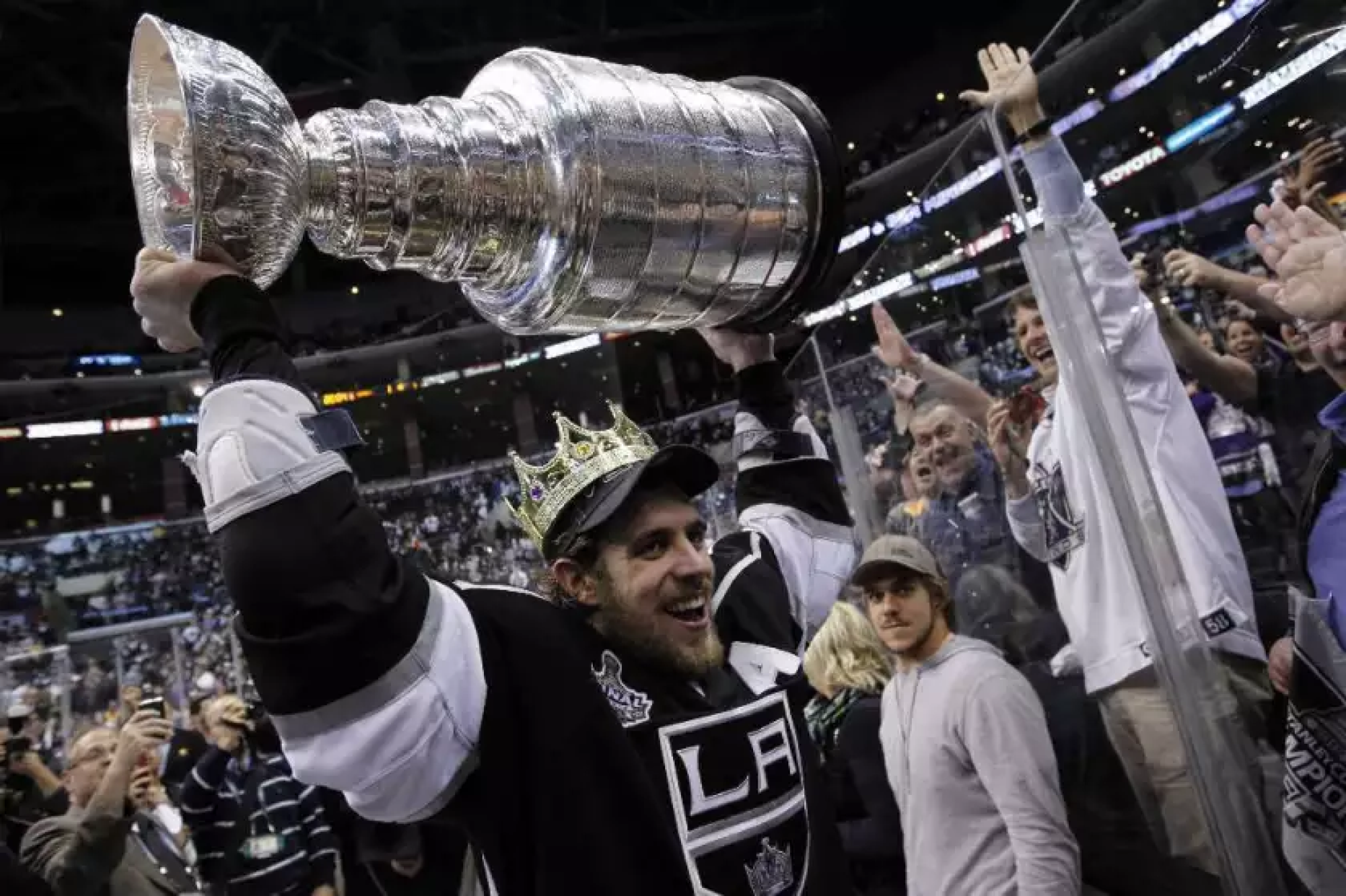 Kings center Anze Kopitar celebrates with the Stanley Cup after the Kings defeated the New Jersey Devils.