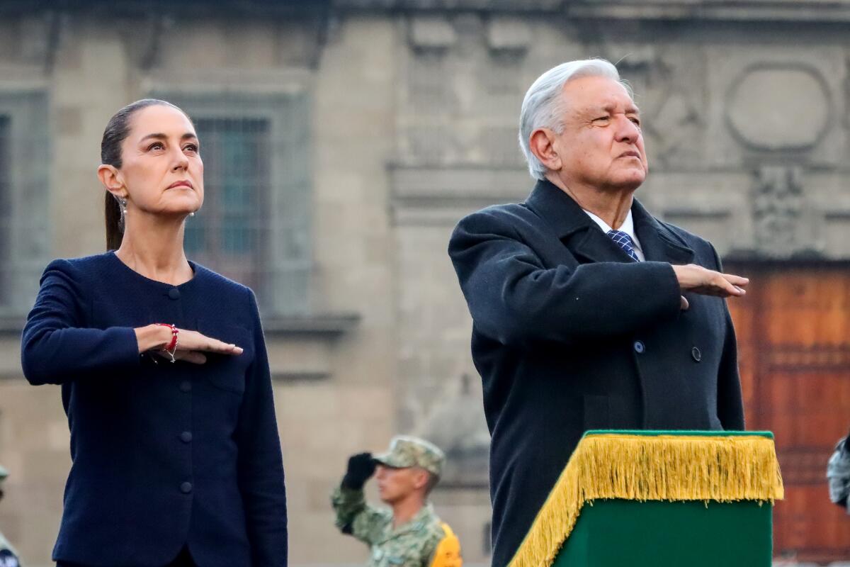 President-elect Claudia Sheinbaum and President Andres Manuel Lopez Obrador pose during the half-mast raising