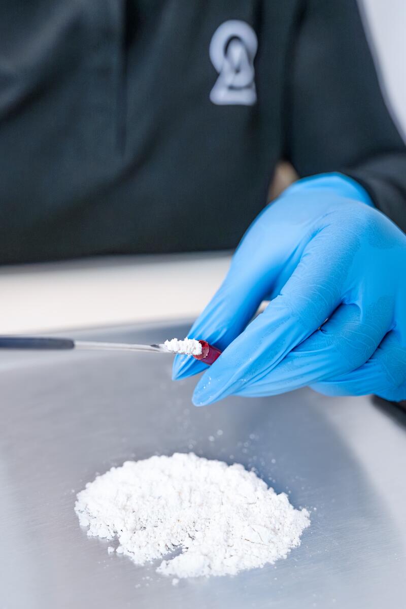 A team member at Ambio Life Sciences in Tijuana prepares a dosage of ibogaine.