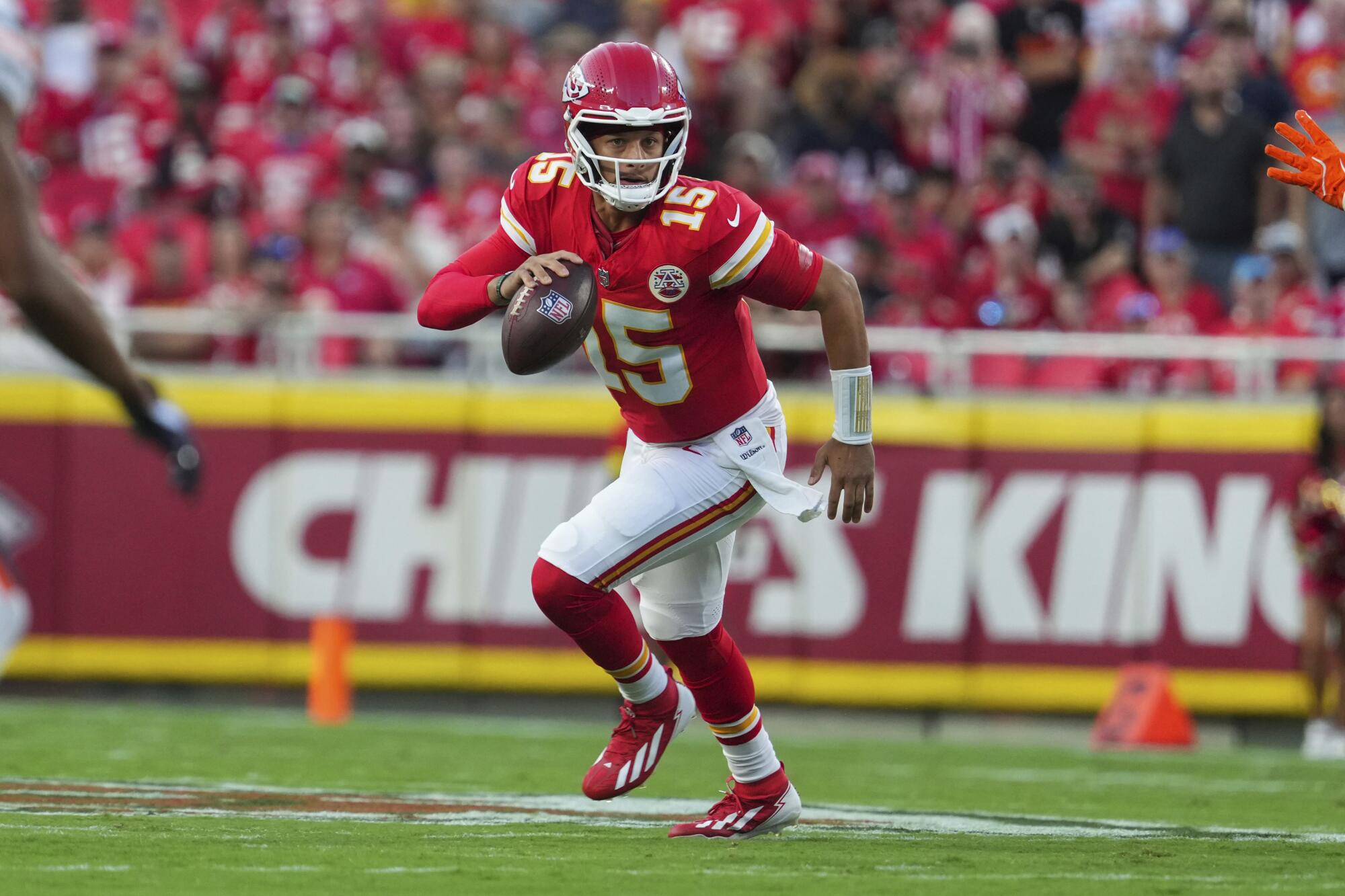 Kansas City Chiefs quarterback Patrick Mahomes looks to pass during a preseason game.