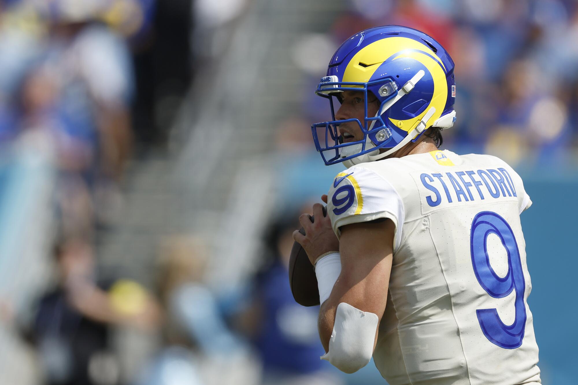 Rams quarterback Matthew Stafford looks to pass in the first half against the Titans on Sunday.