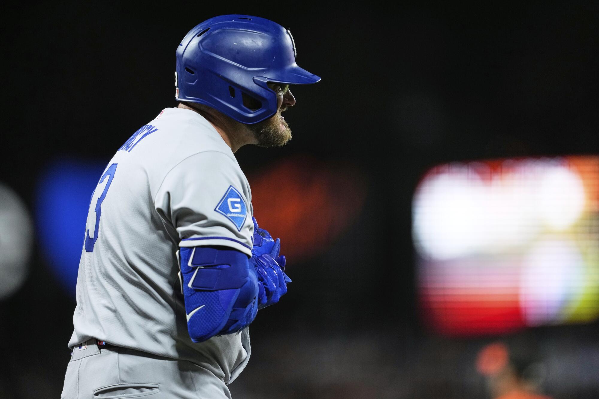 Dodgers third baseman Max Muncy reacts after being hit by a pitch during the eighth inning Friday.