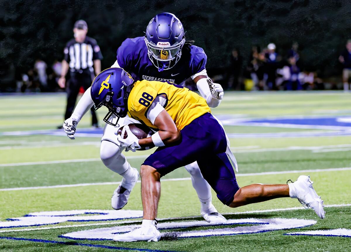 Sam Amuti of Sierra Canyon High prepares to level a Punahou ballcarrier.