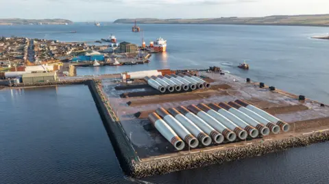 Port of Cromarty Firth The Port of Cromarty is a large industrial area in the sea in the Cromarty Firth. Large turbine towers are laid out on huge, square-shaped quay. There are boats, and an oil rig, in the firth. 
