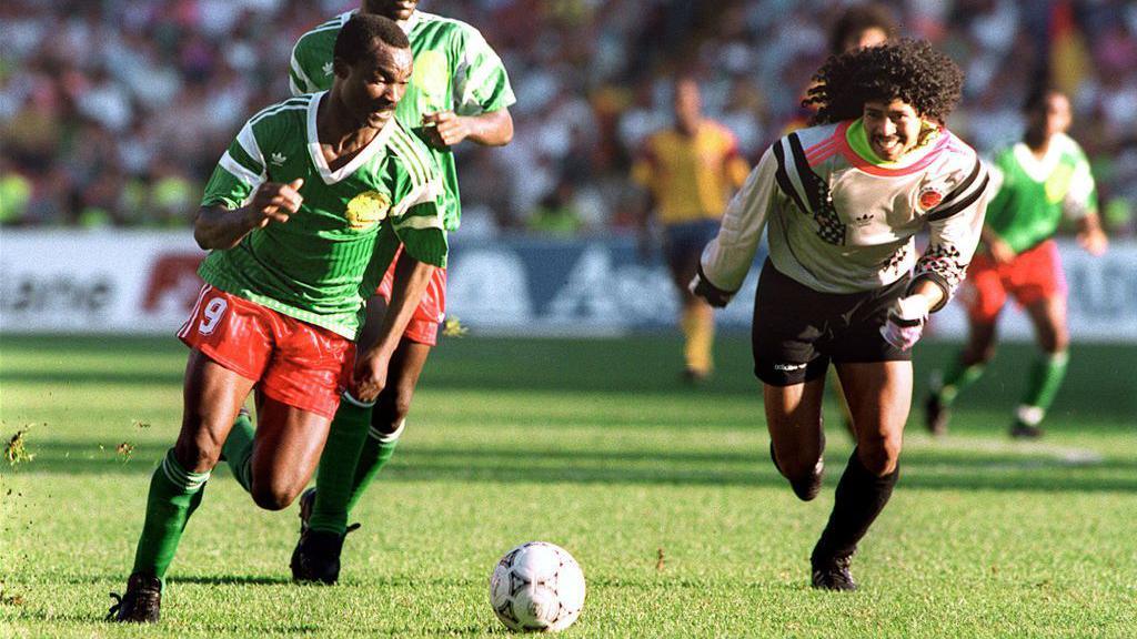 Rene Higuita chases Roger Milla