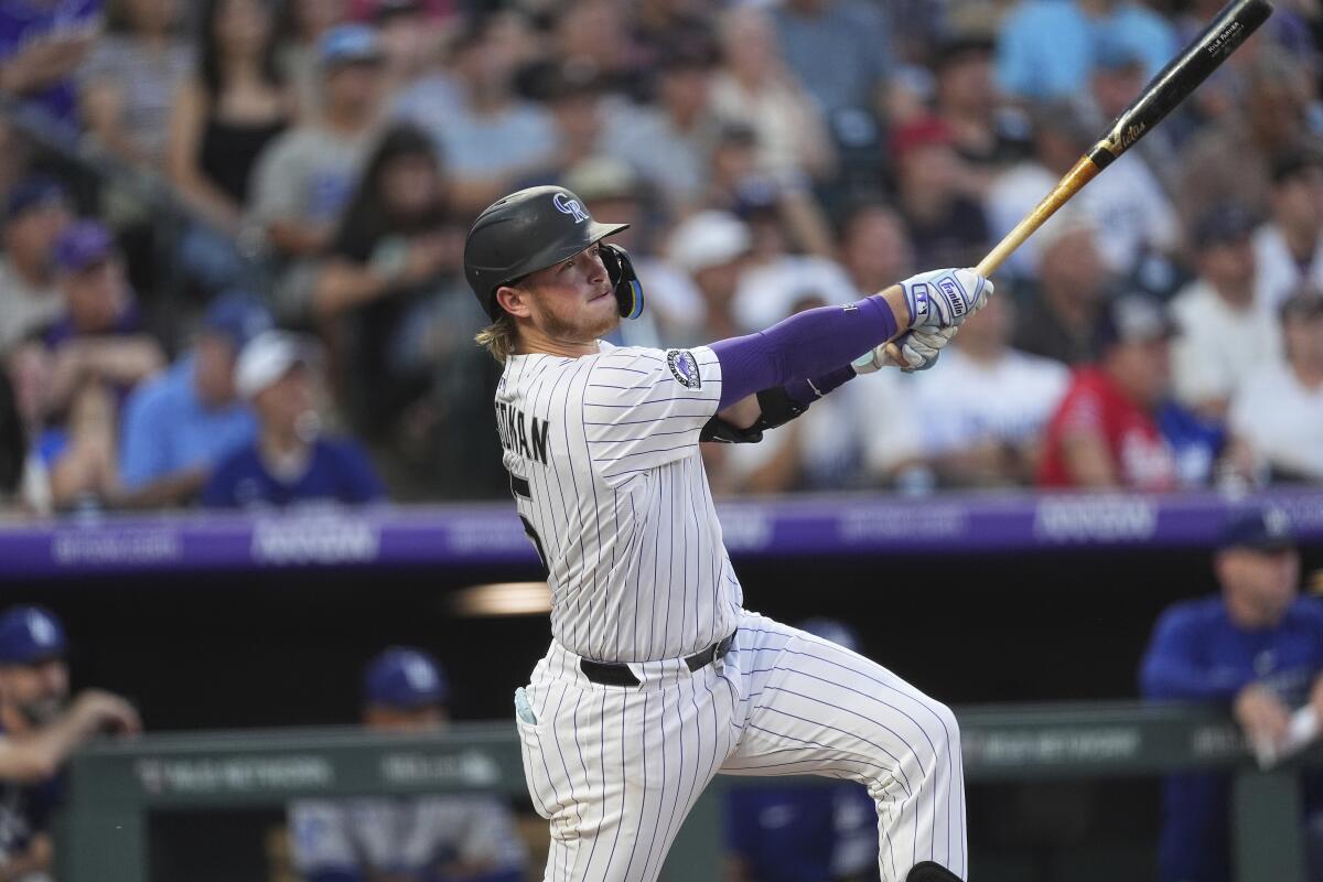 Colorado Rockies catcher Hunter Goodman swings during a game on Aug. 19 against the Dodgers.