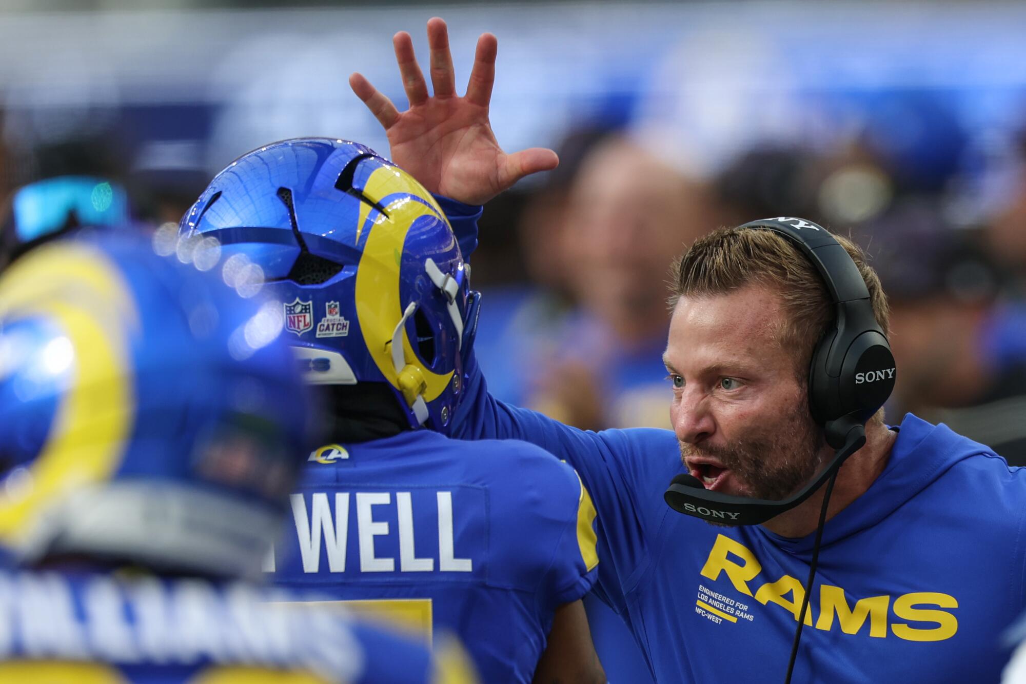 Rams coach Sean McVay celebrates with wide receiver Tutu Atwell after his 88-yard touchdown catch.
