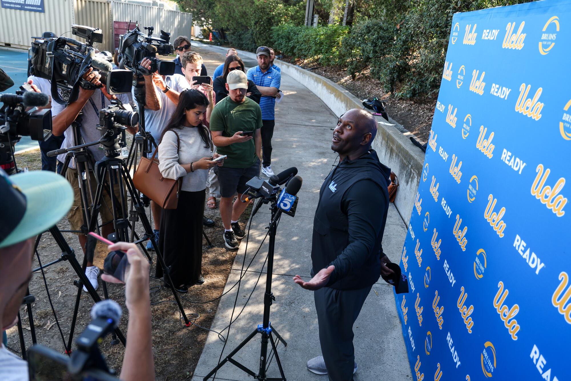 UCLA interim head football coach Tim Skipper talks with media before practice at Drake Stadium on Wednesday.
