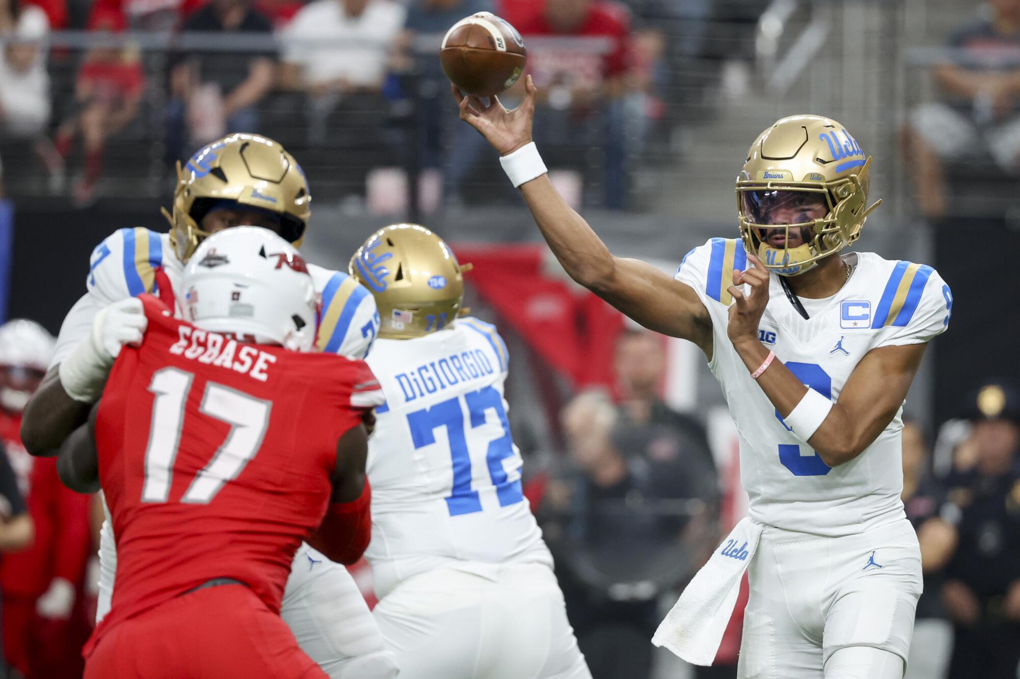 Nico Iamaleava passes against UNLV.