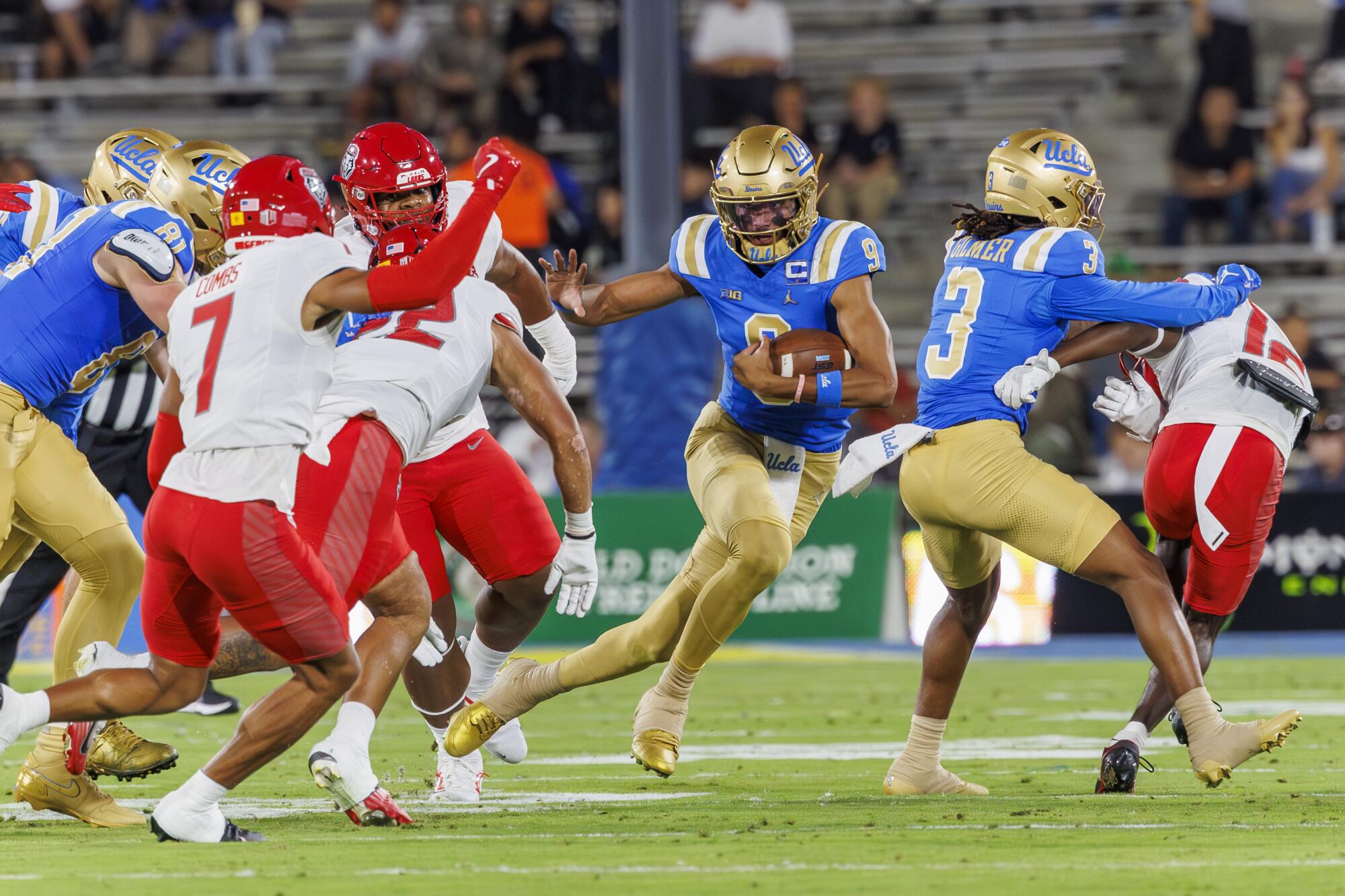 UCLA quarterback Nico Iamaleava runs with the ball during the first half of the Bruins' loss to New Mexico on Friday.