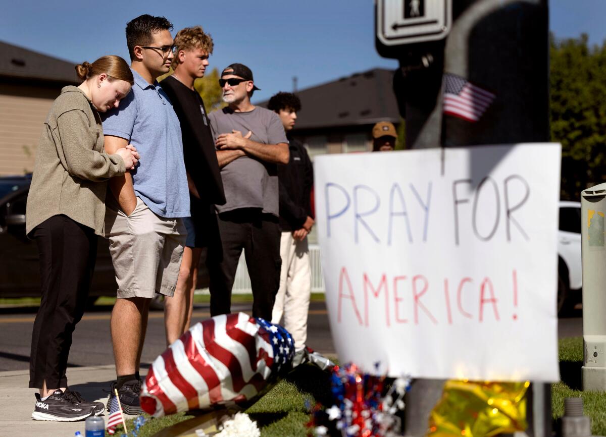 People visit a memorial honoring Charlie Kirk at Timpanogos Regional Hospital in Orem, Utah.