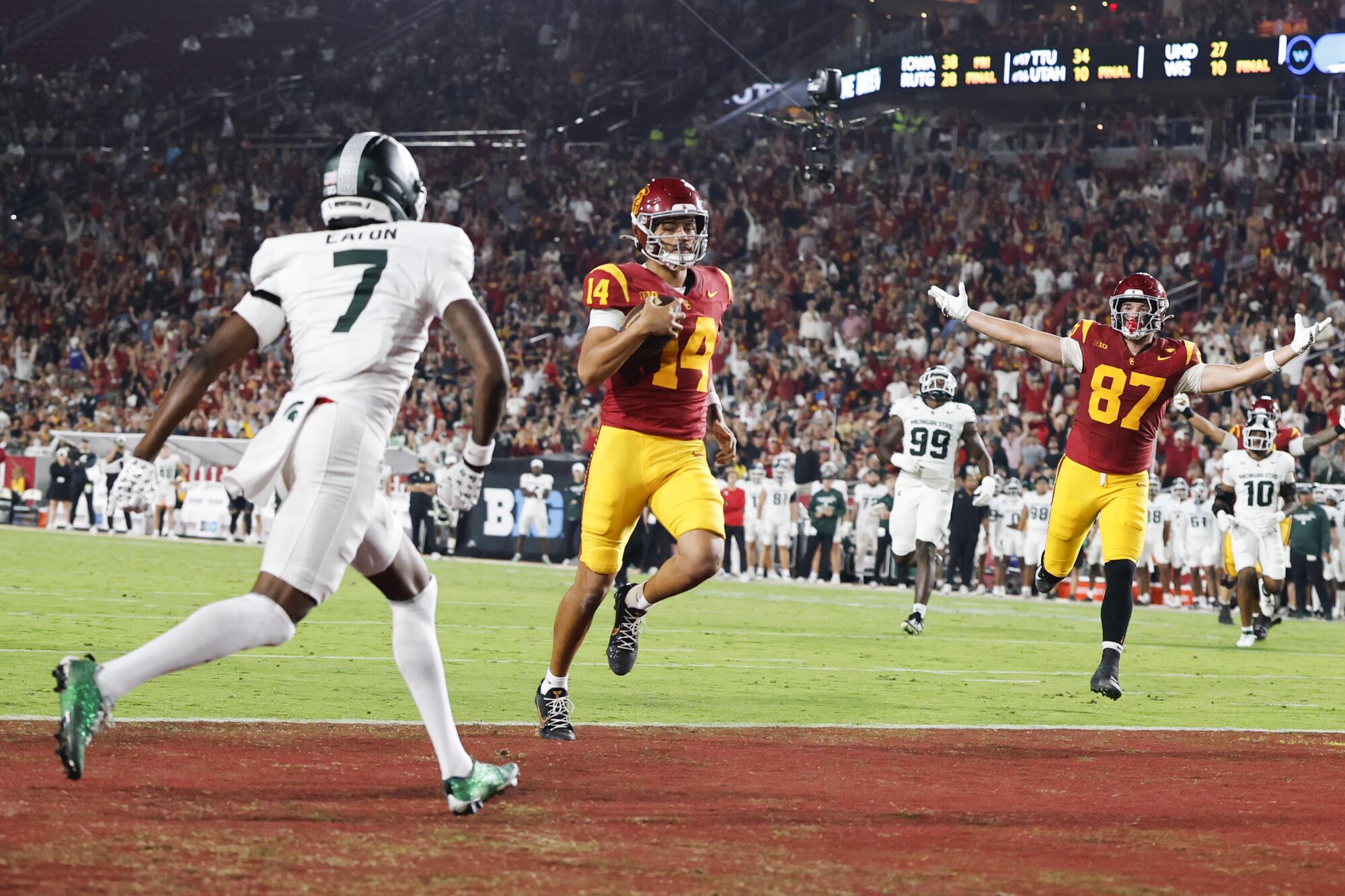 USC quarterback Jayden Maiava scores a touchdown in the first quarter against Michigan State.